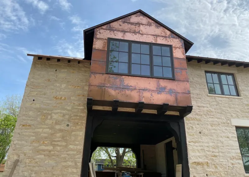Copper metal panel facade on a stone building for Skylight Installation in Aventura